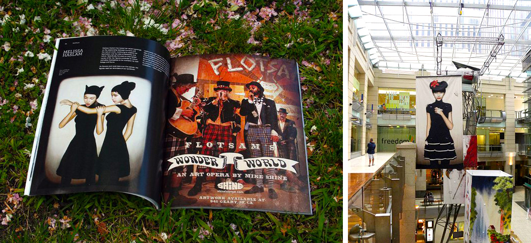 large artwork banner hanging from ceiling in shopping centre